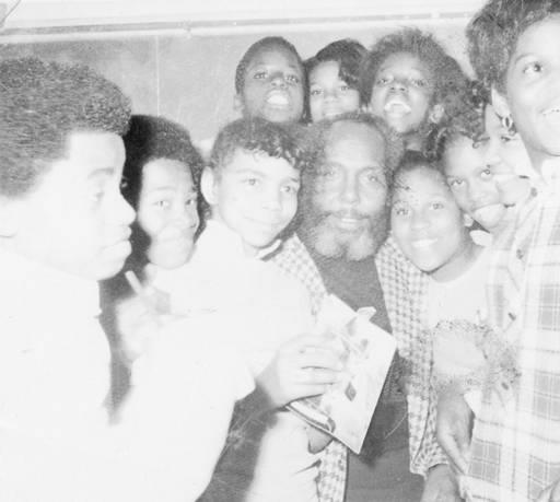 Charles B. Washington with youths he mentored